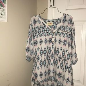 A mid sleeve shirt with a colorful pattern